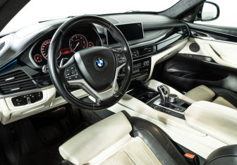 Подержанный автомобиль BMW X6 2016 года (21 фото)