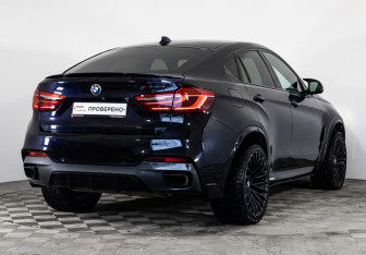 Подержанный автомобиль BMW X6 2015 года (7 фото)