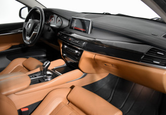 Подержанный автомобиль BMW X6 2016 года (15 фото)