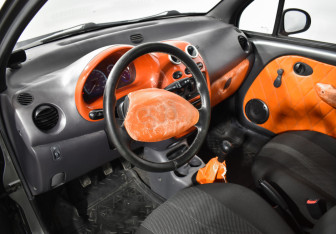 Подержанный автомобиль Daewoo Matiz 2012 года (9 фото)