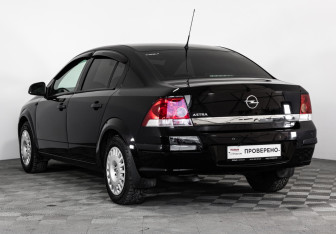 Подержанный автомобиль Opel Astra Sedan 2011 года (8 фото)