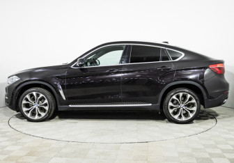 Подержанный автомобиль BMW X6 2016 года (15 фото)