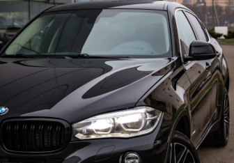 Подержанный автомобиль BMW X6 2015 года (2 фото)