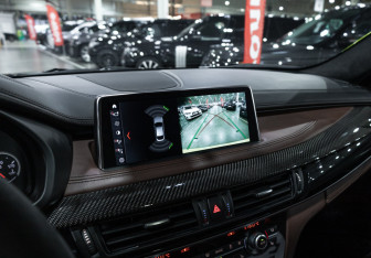 Подержанный автомобиль BMW X6 M 2015 года (21 фото)