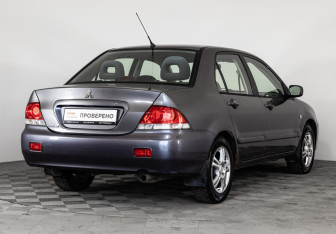 Подержанный автомобиль Mitsubishi Lancer Sedan 2005 года (5 фото)