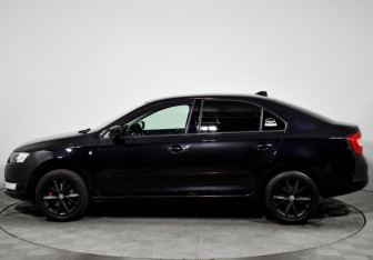 Подержанный автомобиль Skoda Rapid Liftback 2015 года (8 фото)