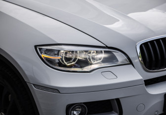 Подержанный автомобиль BMW X6 2013 года (11 фото)