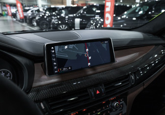 Подержанный автомобиль BMW X6 M 2015 года (22 фото)