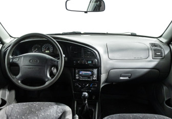 Подержанный автомобиль Kia Spectra Sedan 2006 года (13 фото)