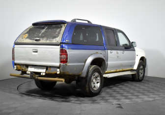 Подержанный автомобиль Mazda B-series 2005 года (5 фото)