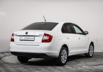 Подержанный автомобиль Skoda Rapid Liftback 2014 года (5 фото)