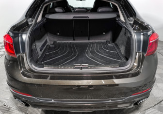 Подержанный автомобиль BMW X6 2015 года (23 фото)