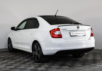 Подержанный автомобиль Skoda Rapid Liftback 2015 года (7 фото)