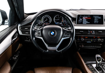 Подержанный автомобиль BMW X6 2015 года (12 фото)