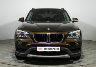 Подержанный автомобиль BMW X1 2014 года (2 фото)