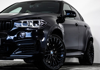 Подержанный автомобиль BMW X6 2015 года (2 фото)