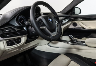 Подержанный автомобиль BMW X6 2016 года (22 фото)