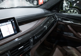 Подержанный автомобиль BMW X6 M 2015 года (25 фото)