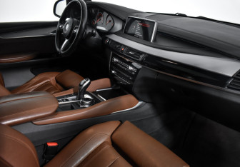 Подержанный автомобиль BMW X6 2016 года (10 фото)