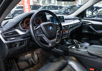 Подержанный автомобиль BMW X6 2016 года (16 фото)