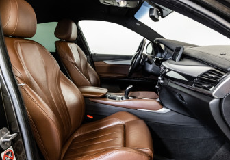 Подержанный автомобиль BMW X6 2015 года (22 фото)