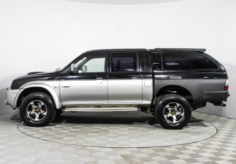 Подержанный автомобиль Mitsubishi L200 2005 года (8 фото)
