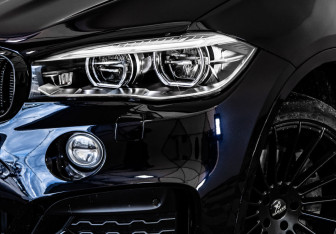 Подержанный автомобиль BMW X6 2015 года (10 фото)