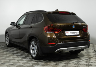 Подержанный автомобиль BMW X1 2014 года (7 фото)