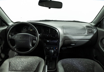 Подержанный автомобиль Kia Spectra Sedan 2008 года (13 фото)