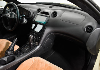 Подержанный автомобиль Toyota Celica Liftback 2002 года (12 фото)