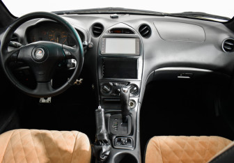 Подержанный автомобиль Toyota Celica Liftback 2002 года (13 фото)