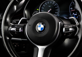 Подержанный автомобиль BMW X6 2015 года (14 фото)