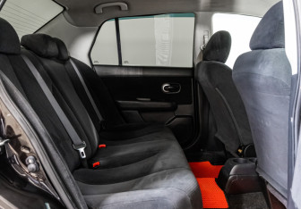 Подержанный автомобиль Nissan Tiida Sedan 2010 года (14 фото)