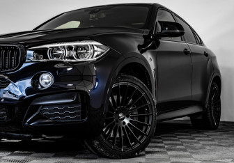Подержанный автомобиль BMW X6 2015 года (2 фото)