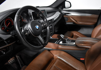 Подержанный автомобиль BMW X6 2016 года (9 фото)
