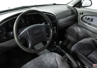 Подержанный автомобиль Kia Spectra Sedan 2006 года (11 фото)