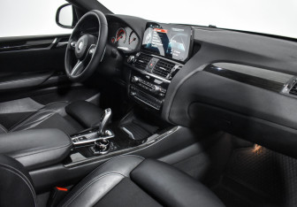 Подержанный автомобиль BMW X4 2015 года (14 фото)