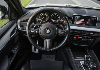 Подержанный автомобиль BMW X6 2017 года (14 фото)