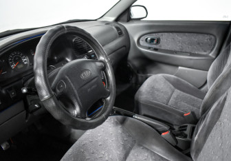 Подержанный автомобиль Kia Spectra Sedan 2007 года (9 фото)