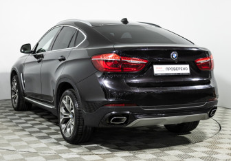 Подержанный автомобиль BMW X6 2016 года (13 фото)