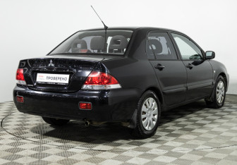 Подержанный автомобиль Mitsubishi Lancer Sedan 2009 года (5 фото)