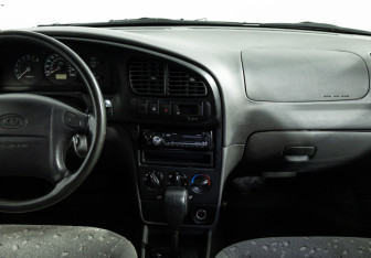 Подержанный автомобиль Kia Spectra Sedan 2008 года (14 фото)