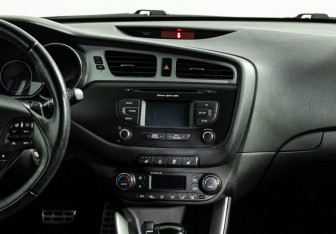 Подержанный автомобиль Kia Ceed Wagon 2014 года (14 фото)