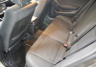 Подержанный автомобиль BMW X1 2012 года (11 фото)