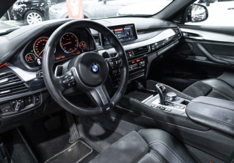Подержанный автомобиль BMW X6 2016 года (18 фото)