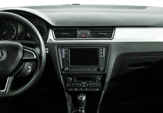 Подержанный автомобиль Skoda Rapid Liftback 2014 года (14 фото)
