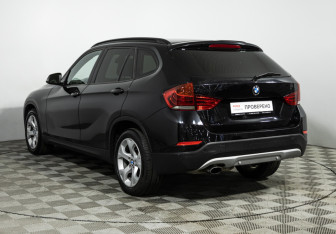 Подержанный автомобиль BMW X1 2014 года (7 фото)