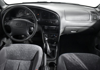 Подержанный автомобиль Kia Spectra Sedan 2007 года (14 фото)