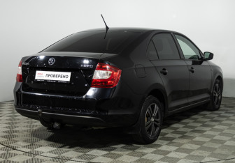 Подержанный автомобиль Skoda Rapid Liftback 2014 года (5 фото)